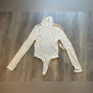 NWT urban outfitters cream turtleneck body suit